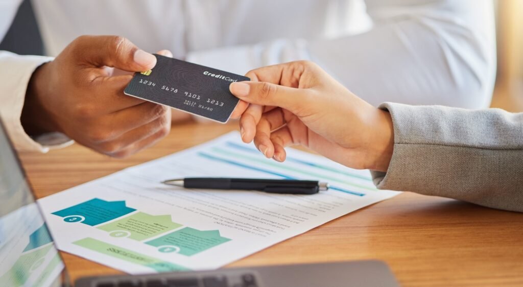 Image of a credit card being used for payment in a business credit repair context.