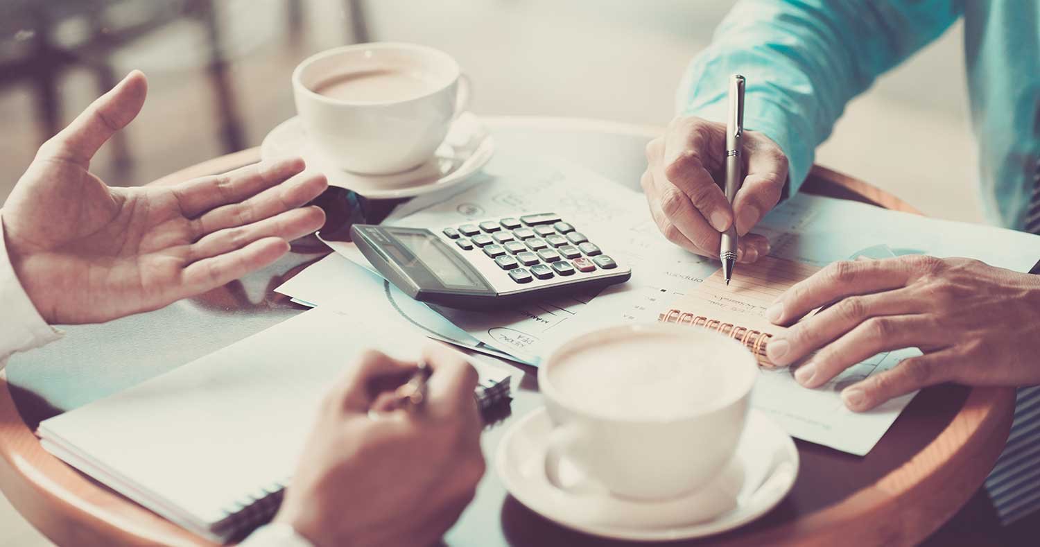 Business professionals collaborating on a credit consulting plan, discussing strategies and analyzing data together.